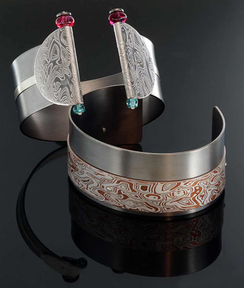 Titanium bracelets: Hathor and Bes